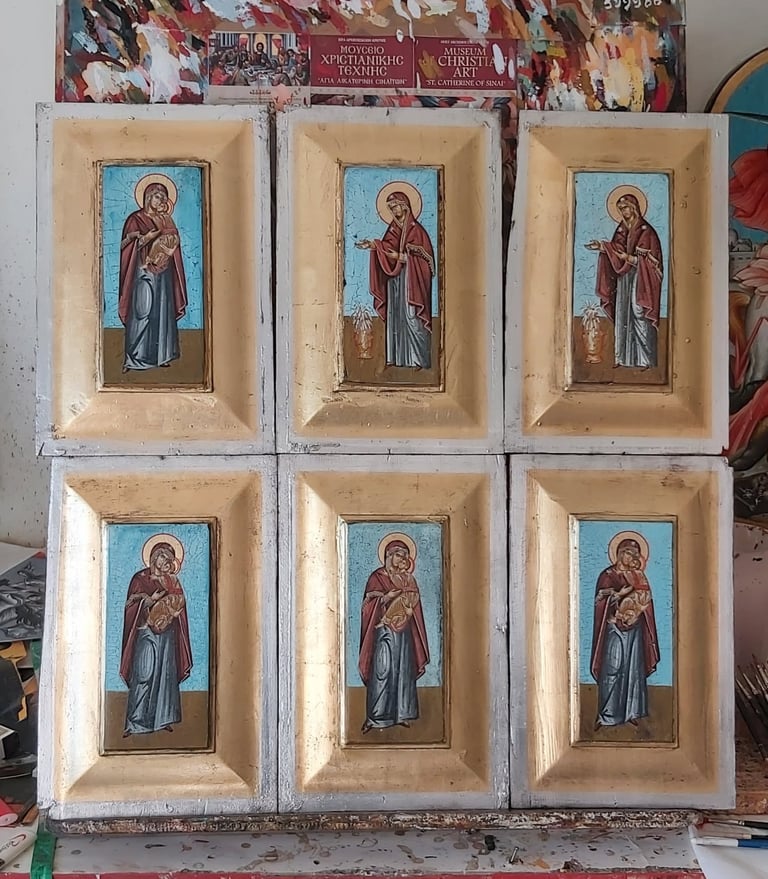 Six religious icon tiles arranged in a 2x3 grid, each featuring a Byzantine-style saint figure with blue background in cream-colored frames