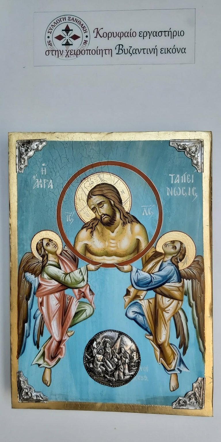Byzantine religious icon depicting Jesus Christ in a halo, flanked by two angels, with ornate gold frame and Greek text labels