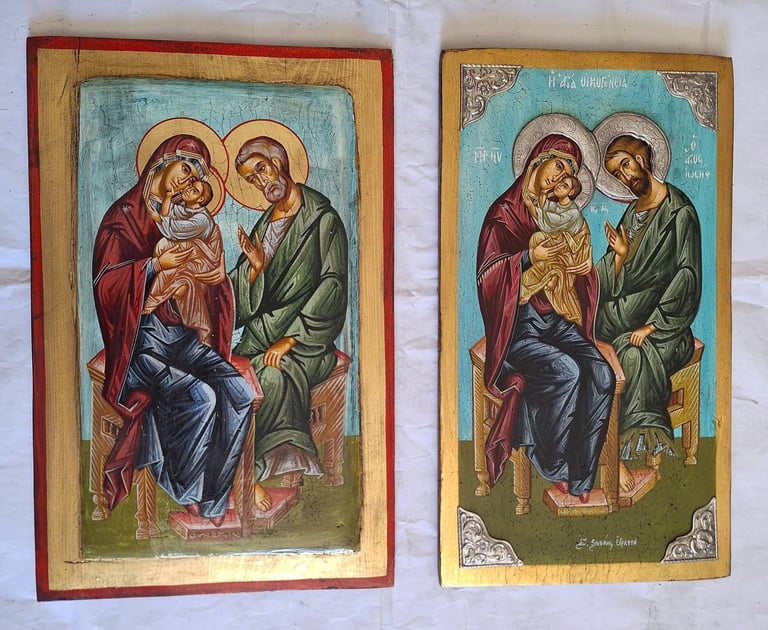 Two religious icon paintings depicting the Holy Family: Mary and Joseph with the infant Jesus, shown side by side with ornate wooden frames