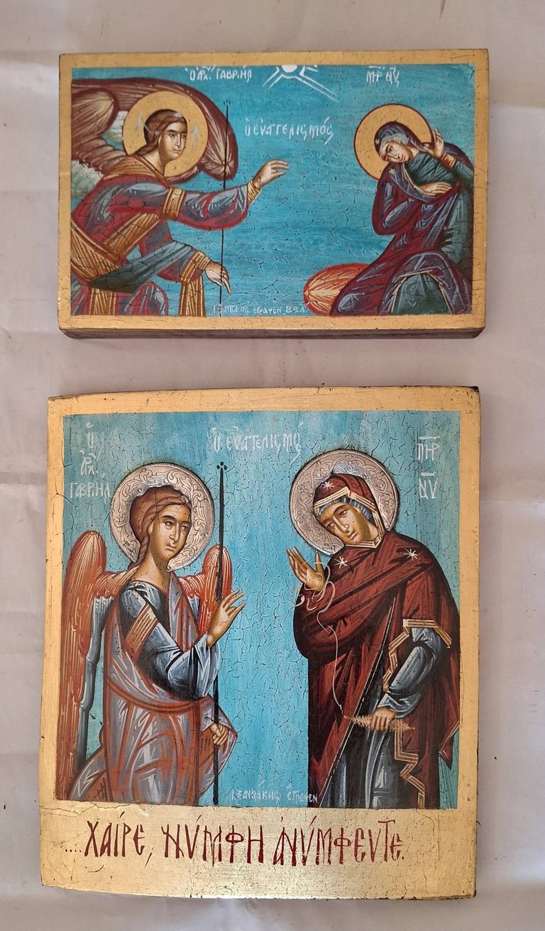 Two vintage Orthodox Christian religious icons with gold backgrounds depicting saints with halos in traditional Byzantine style