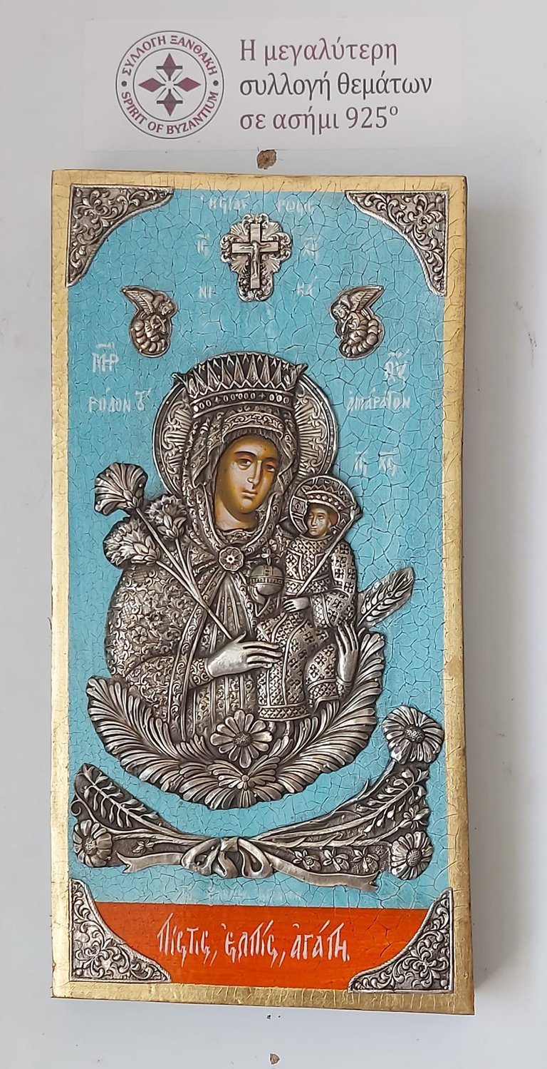 Byzantine 925 silver religious icon depicting Mother Mary holding Christ child with ornate details on turquoise background