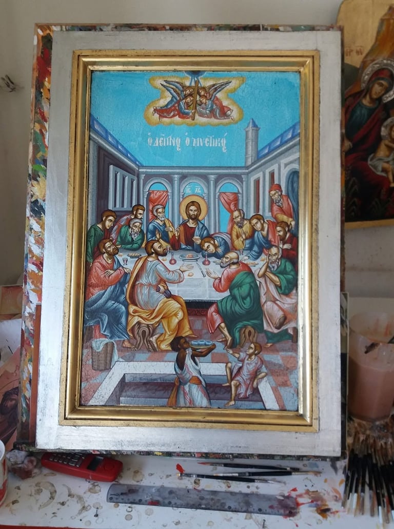 Religious framed icon painting depicting the Last Supper with Christ and disciples seated at a table in Byzantine style