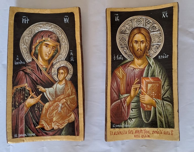 Two Byzantine religious icons featuring a Madonna and child on the left and Christ Pantocrator on the right, both with halos on gold backgrounds.