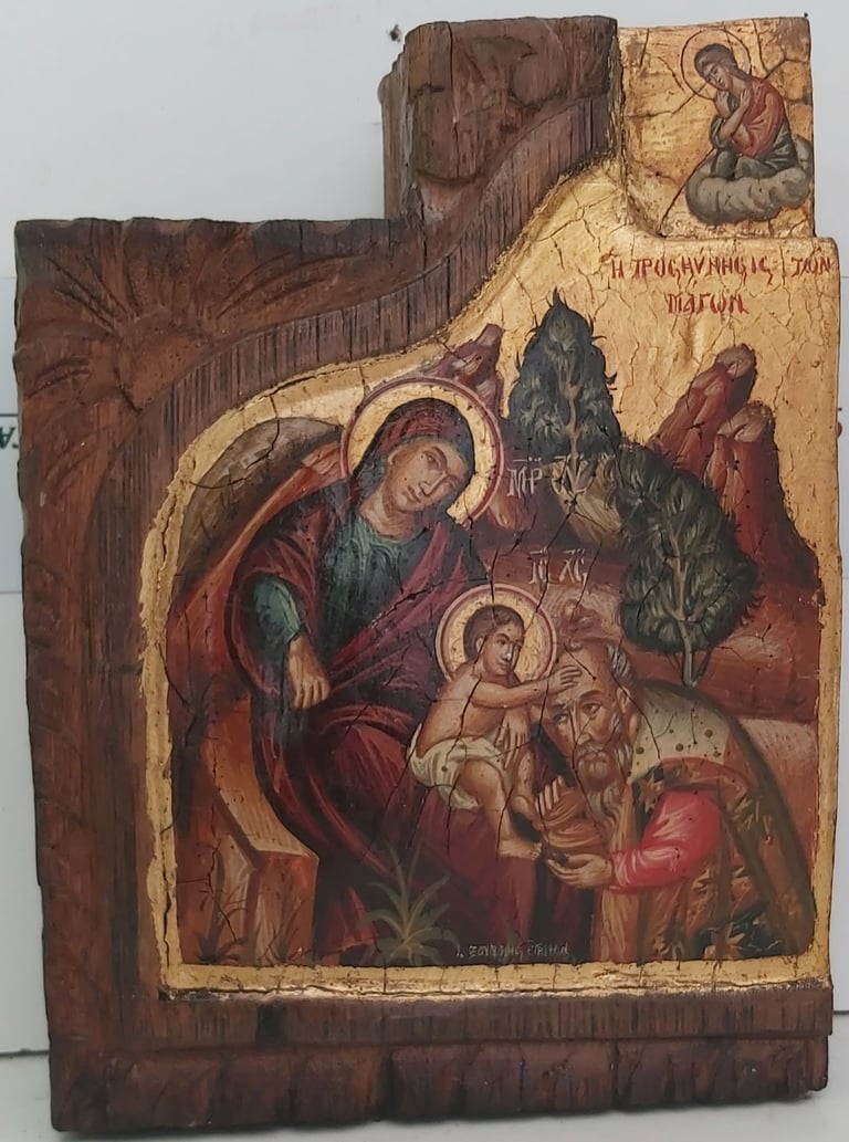 Antique Eastern Orthodox icon depicting Virgin Mary with Christ Child, figures in red robes, and saints with halos on aged wood panel