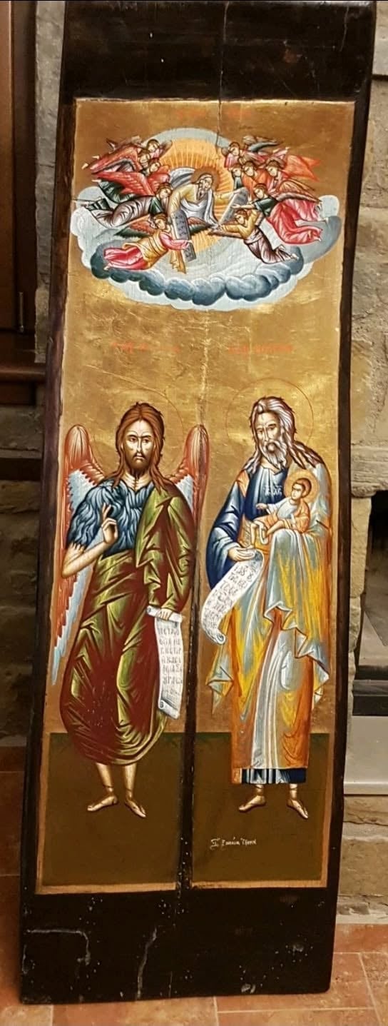 Religious icon painting on wood panel depicting Jesus Christ with wings on left, Virgin Mary holding infant Jesus on right, and angels in clouds above.