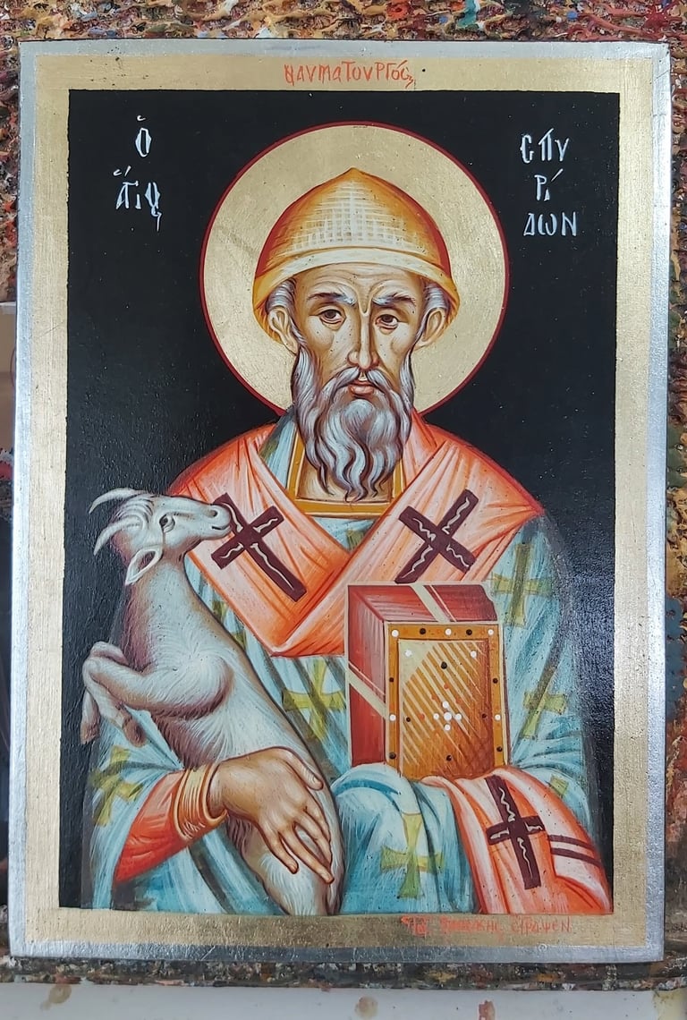 Orthodox icon of Saint Basil with golden halo, holding a gospel book and lamb, wearing red and blue religious vestments