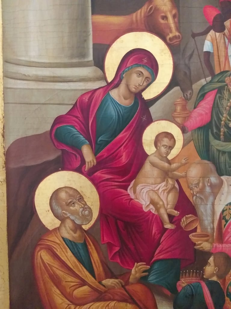 Orthodox Christian religious icon depicting Mary holding the Christ child with Saint Peter and other figures, all with golden halos