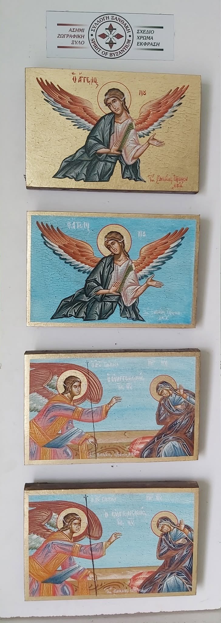 Collection of four Byzantine religious icon cards featuring angel and religious figure imagery with gold leaf and Greek text labels