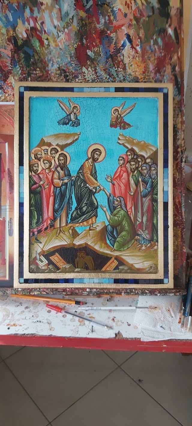 Orthodox religious icon painting featuring Jesus Christ surrounded by saints and apostles with angels above on turquoise background