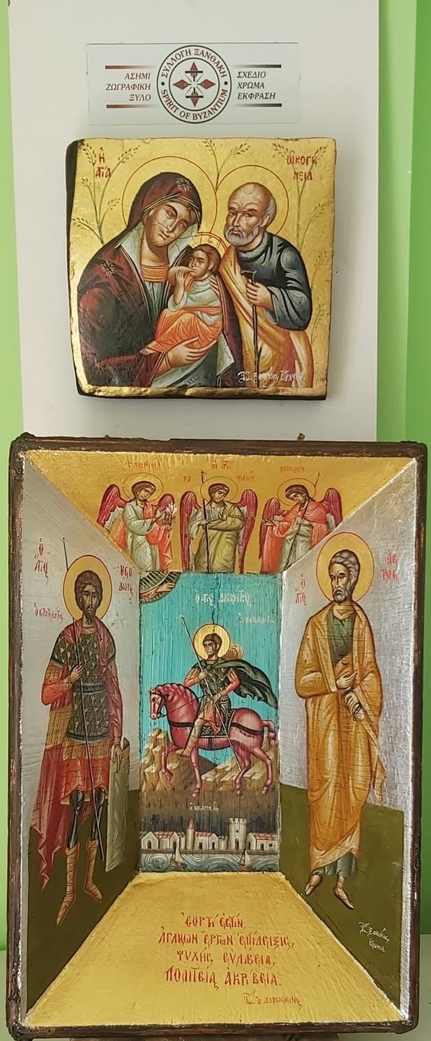 Two Byzantine religious icons on a green wall featuring saints and religious figures in traditional Orthodox iconographic style with gold leaf backgrounds