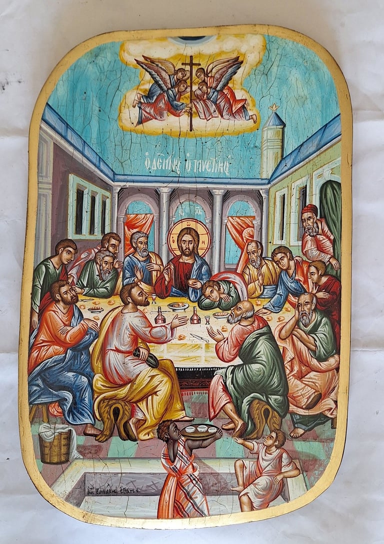 Byzantine religious icon depicting the Last Supper with Jesus and apostles gathered around a table with liturgical elements and angels above