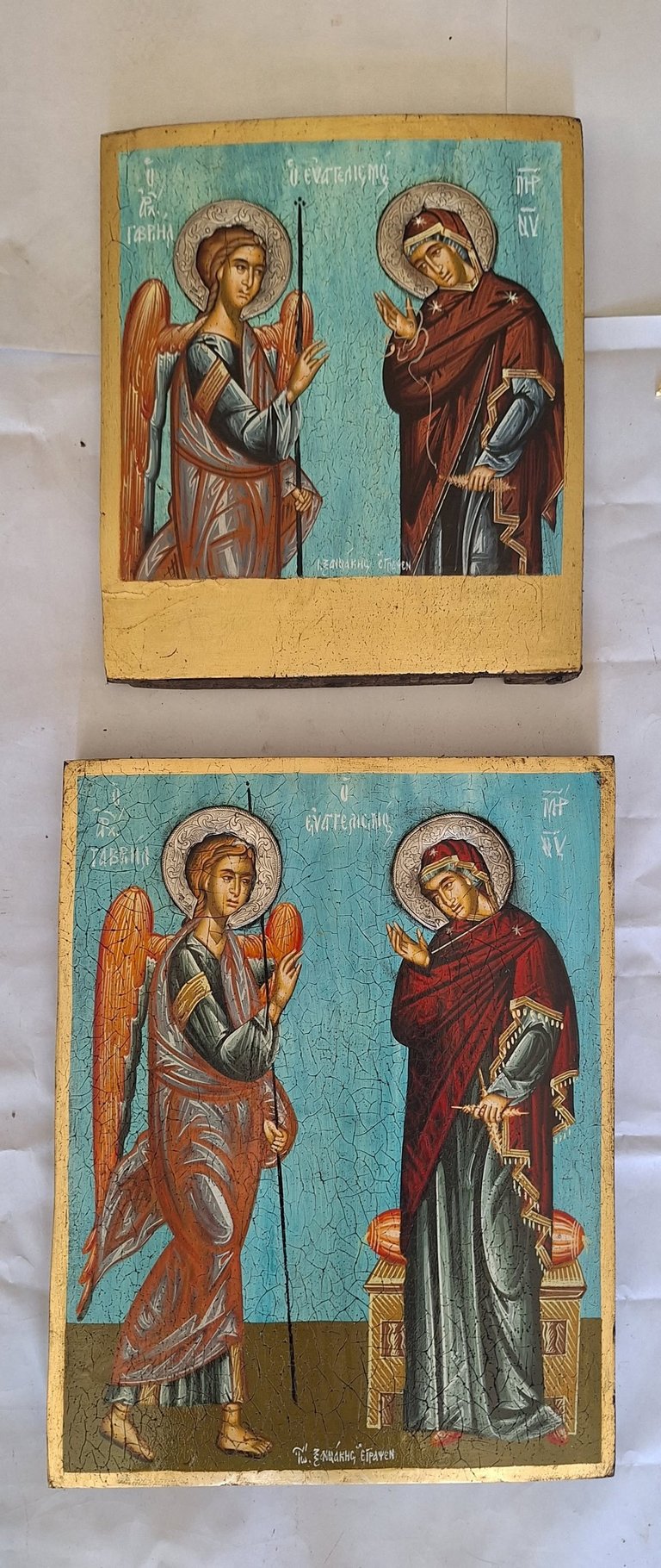 Two Eastern Orthodox religious icons depicting saints with halos in traditional Byzantine style, featuring gold leaf and tempera on wooden panels against a turquoise background.