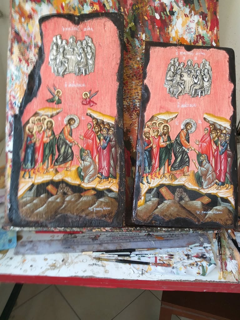 Two Orthodox religious icon paintings on wooden panels with pink backgrounds depicting biblical scenes and figures